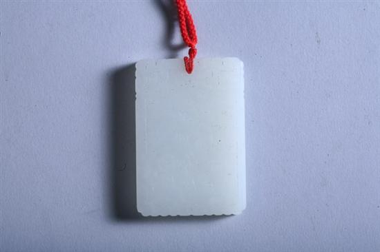 Appraisal: CHINESE WHITE JADE PENDANT Figures and calligraphy decoration - in