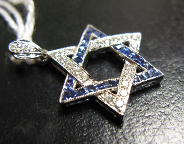 Appraisal: SAPPHIRE DIAMOND AND EIGHTEEN KARAT WHITE GOLD STAR PENDANT set