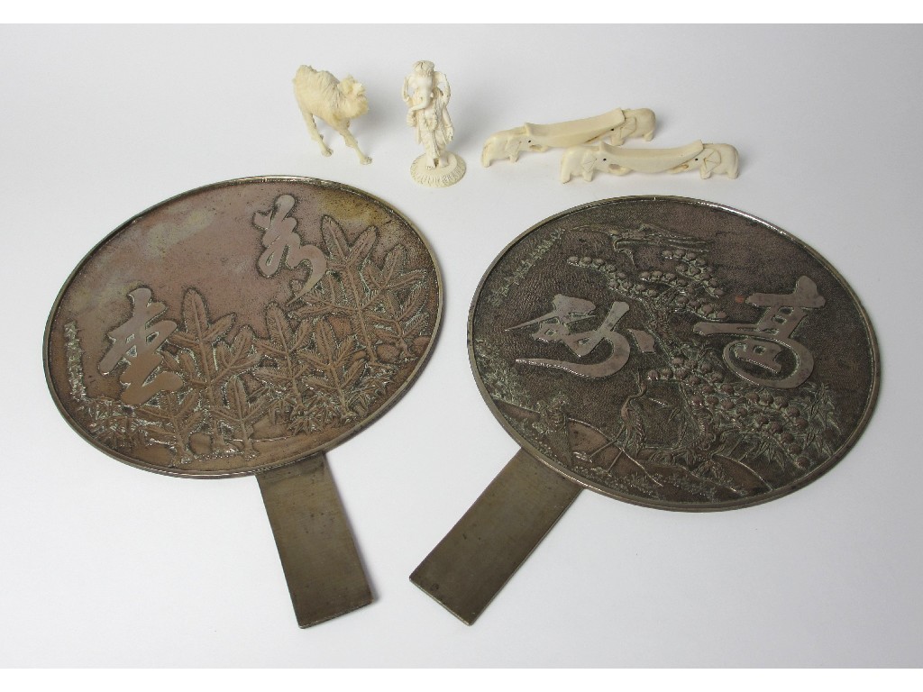 Appraisal: Two Chinese brass cast hand mirrors cm long ivory camel