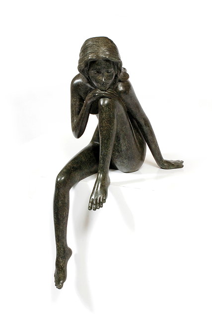 Appraisal: AN UNSIGNED BRONZE SCULPTURE of a nude girl her head