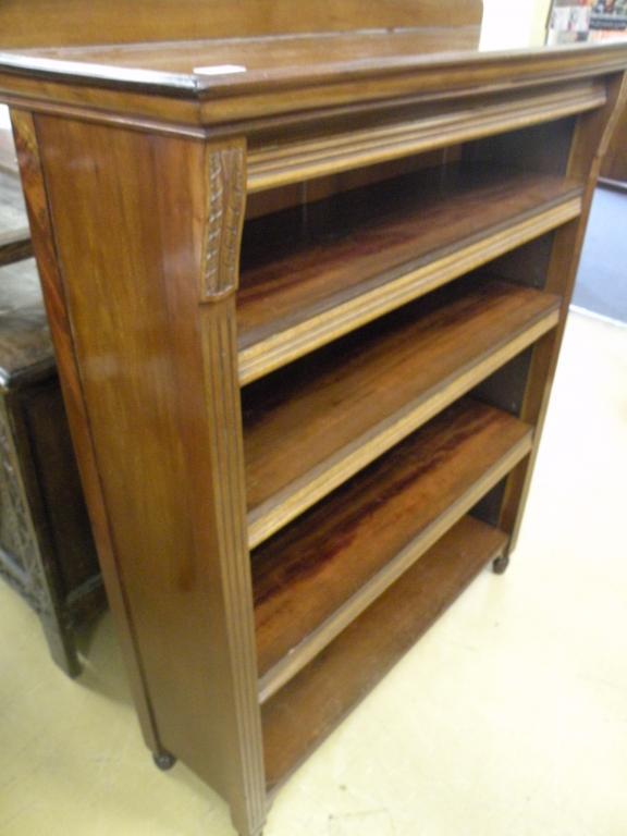 Appraisal: A late Victorian walnut open bookcase