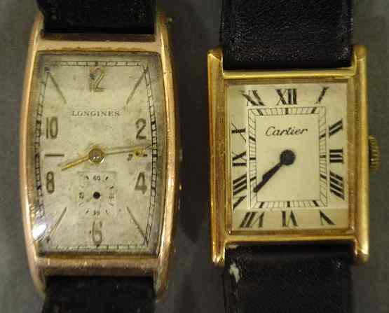 Appraisal: Cartier k gold electroplated wristwatch and a Longines wristwatch As