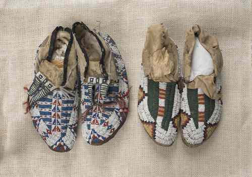 Appraisal: Two pair of Plains beaded hide moccasins one with beaded