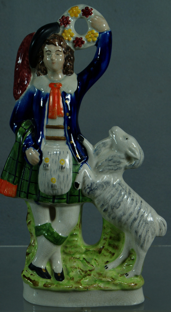 Appraisal: English Staffordshire figure of a Scottish man with goat h