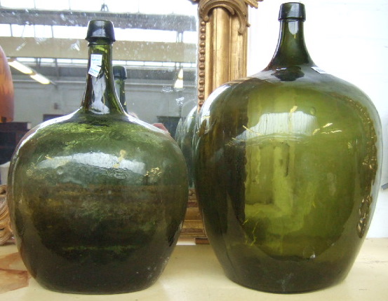 Appraisal: Two green glass wine bottles of bulbous form th century