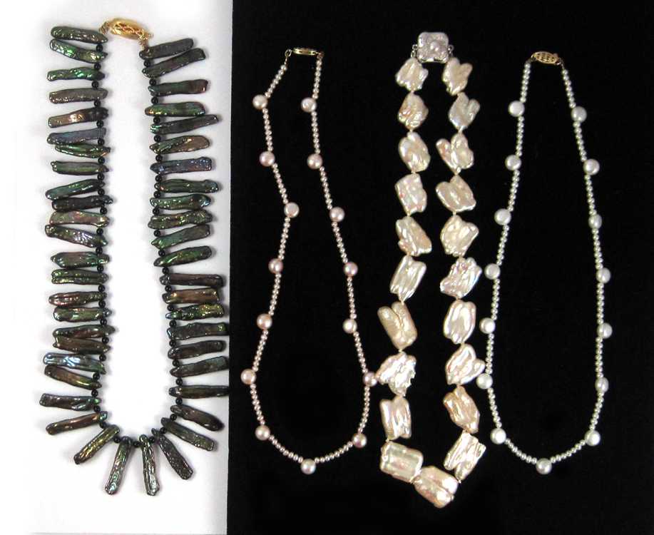 Appraisal: FOUR PEARL NECKLACES the first a dark green stick shape