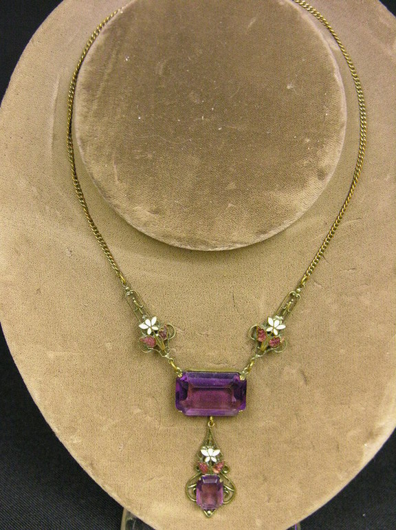 Appraisal: VICTORIAN AMETHYST NECKLACE White enamelled flowers Weight grams Necklace Size