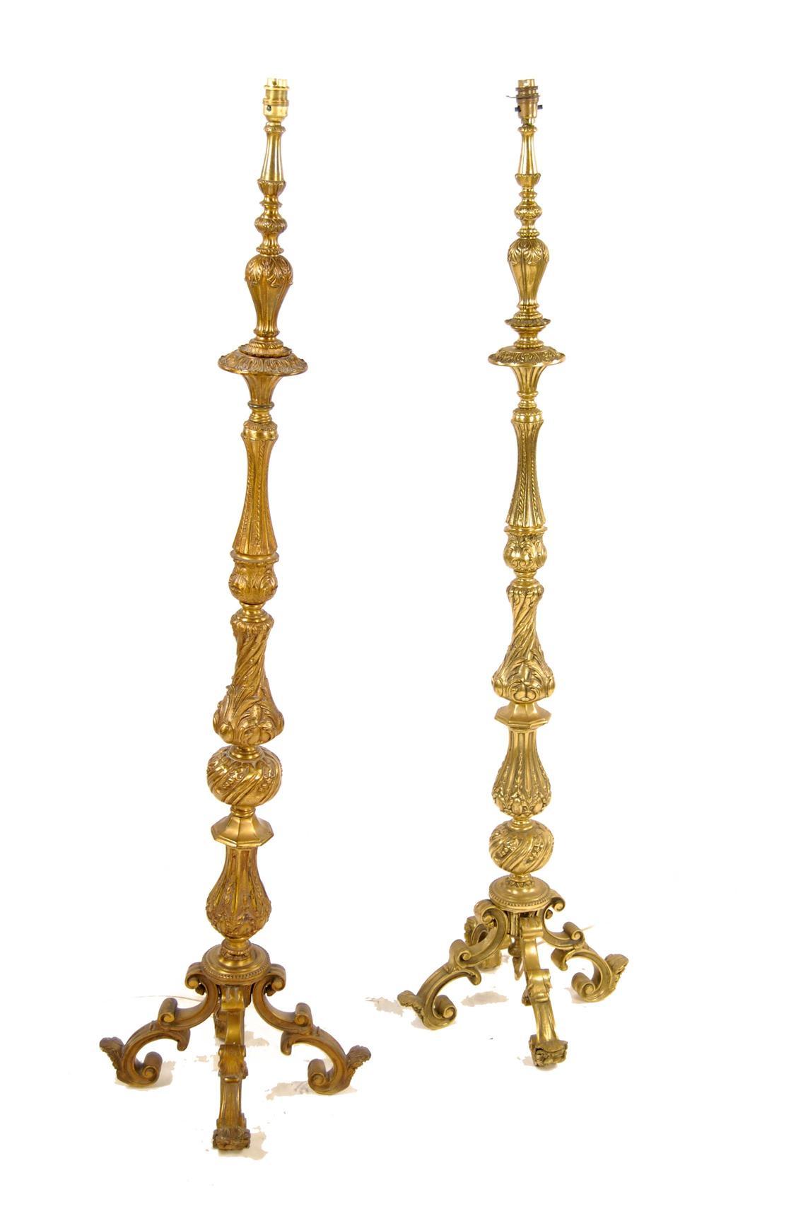 Appraisal: A pair of brass Regence style standard lamps