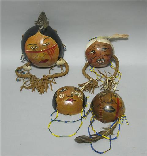 Appraisal: FOUR PAINTED GOURD HEAD MASKS Attr Ron Rivera Attributed to