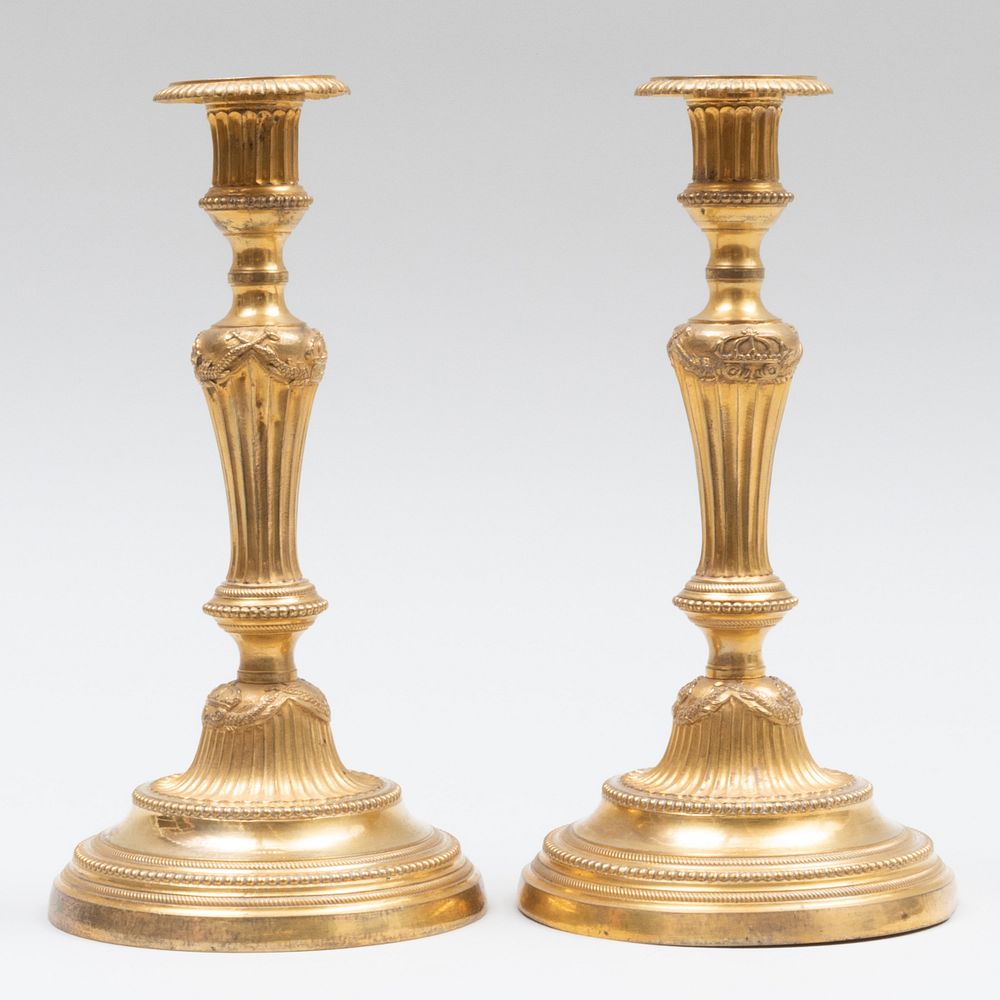 Appraisal: Pair of R gence Ormolu Candlesticks Cast with crowned entwined