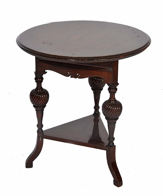 Appraisal: A MAHOGANY CIRCULAR OCCASIONAL TABLE on carved baluster legs and