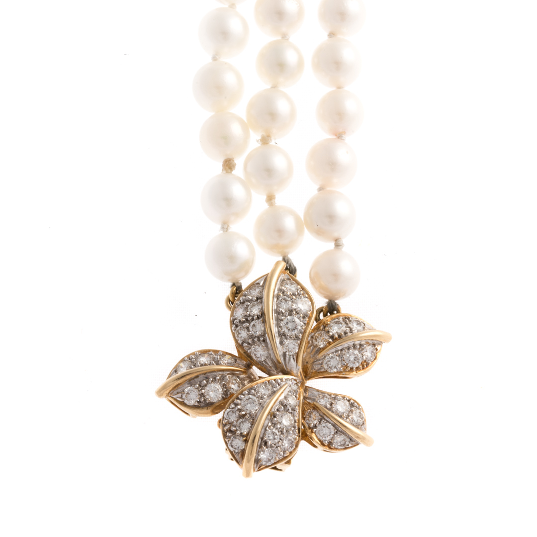 Appraisal: A Triple Strand of Pearls with Diamond Clasp Triple strand