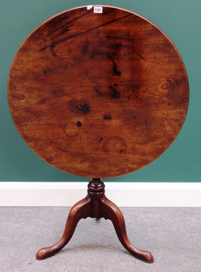 Appraisal: An th century mahogany tripod table the one piece circular