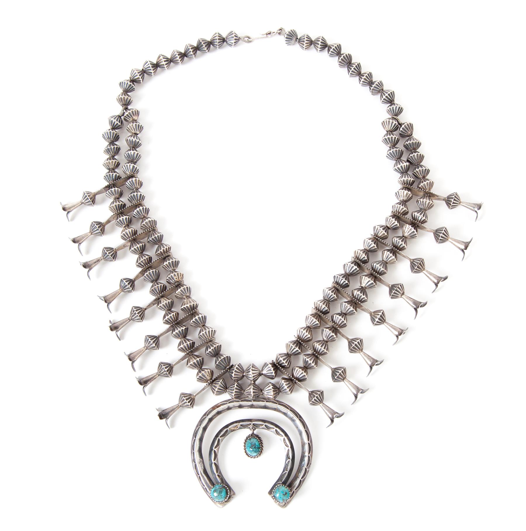 Appraisal: NAVAJO SILVER AND TURQUOISE SQUASH BLOSSOM NECKLACE Native American mid