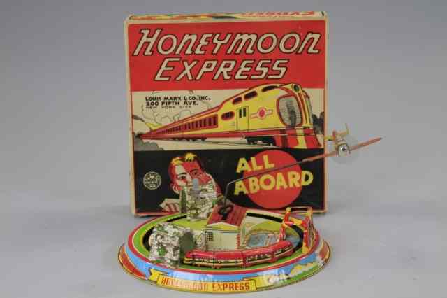 Appraisal: BOXED HONEYMOON EXPRESS Marx Toys lithographed tin clockwork action allows