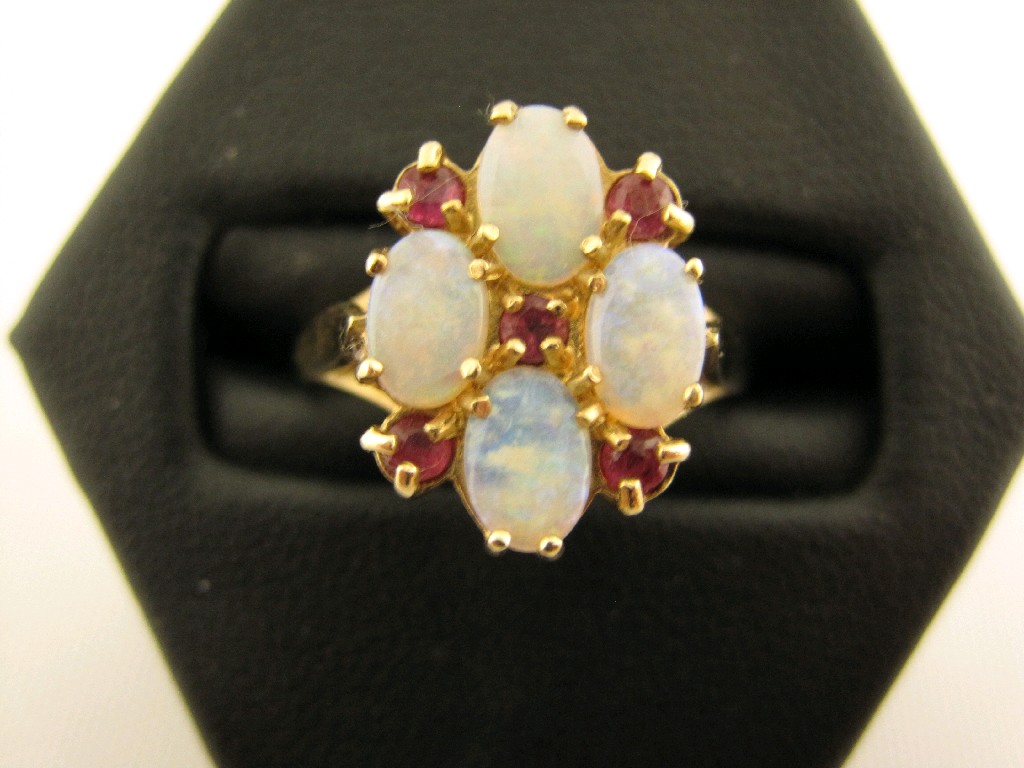 Appraisal: An Opal and Ruby Cluster Ring claw-set four oval cabochons