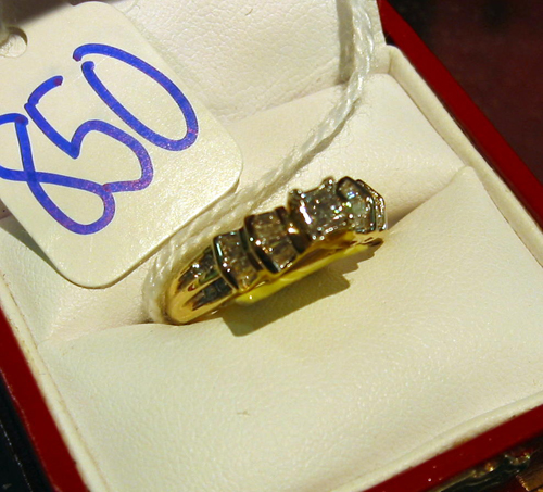 Appraisal: DIAMOND AND FOURTEEN KARAT GOLD RING centering a princess-cut diamond