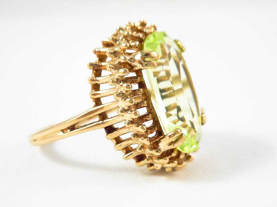 Appraisal: YELLOWISH GREEN SPINEL AND TEN KARAT GOLD RING set with