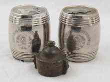 Appraisal: A pair of Soviet Russian silver plated barrel money boxes