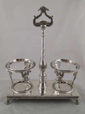 Appraisal: An oil and vinegar cruet stand in the classical manner