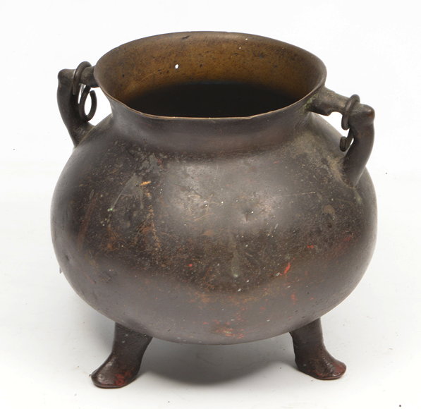 Appraisal: A SMALL BRONZE TWO HANDLED OVOID CAULDRON on three feet