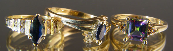 Appraisal: GOLD RINGS- TOPAZ SAPPHIRE AND DIAMONDS K yellow gold ring