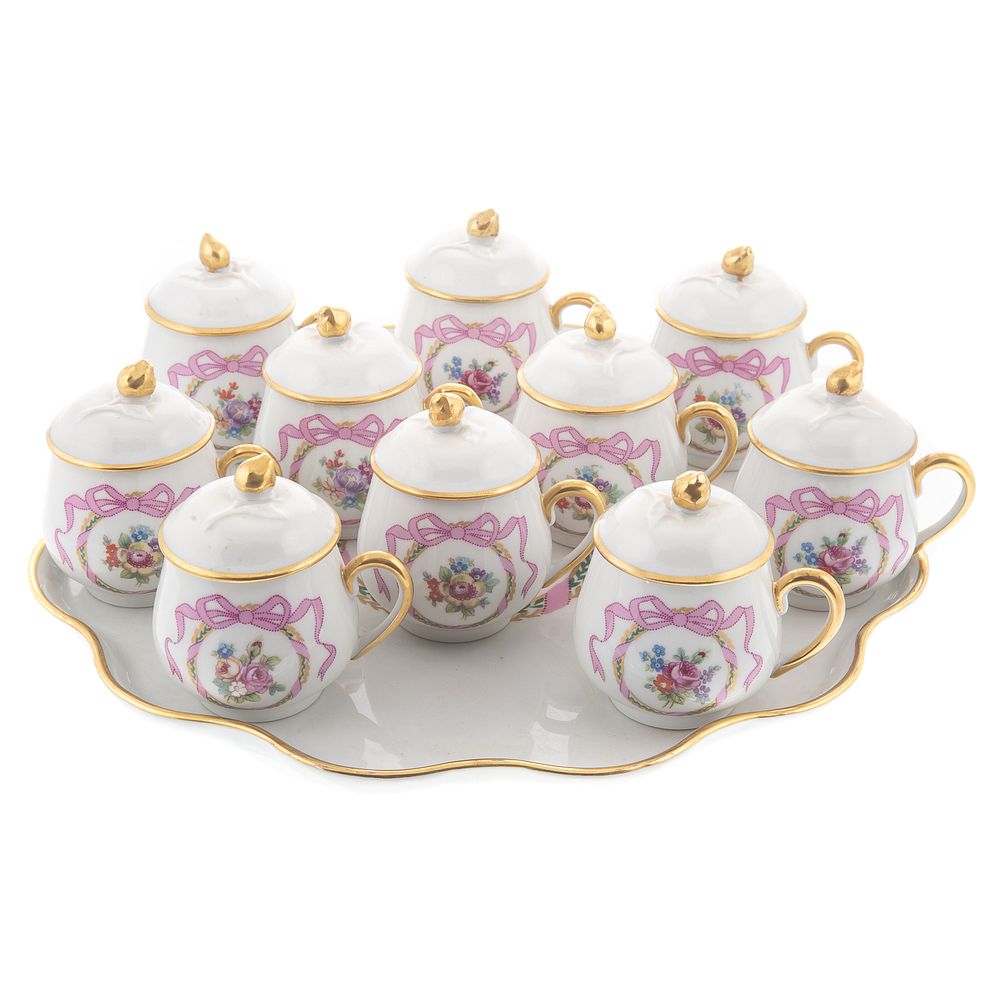 Appraisal: Limoges Porcelain Pot-de-Cremes Tray Each decorated with floral and ribbon