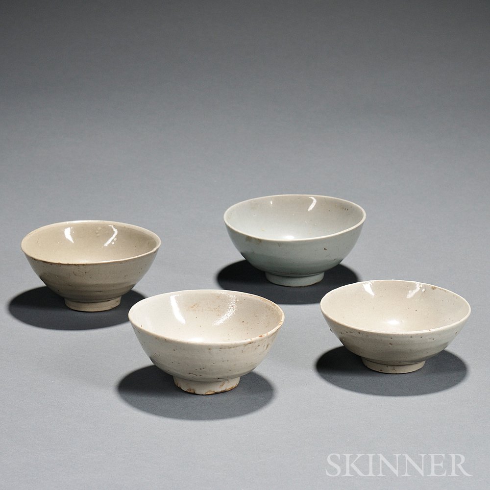 Appraisal: Four Pale Celadon Bowls China Song dynasty-style each resting on