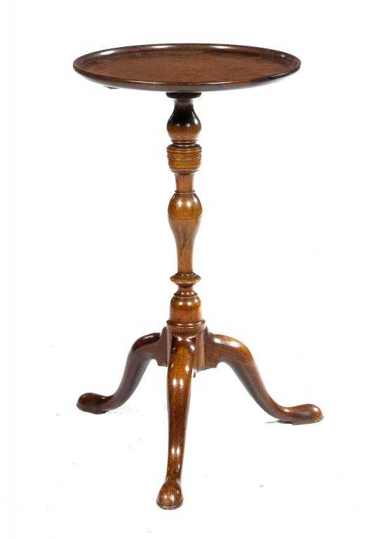 Appraisal: A MAHOGANY TRIPOD TABLE the dished circular top on double