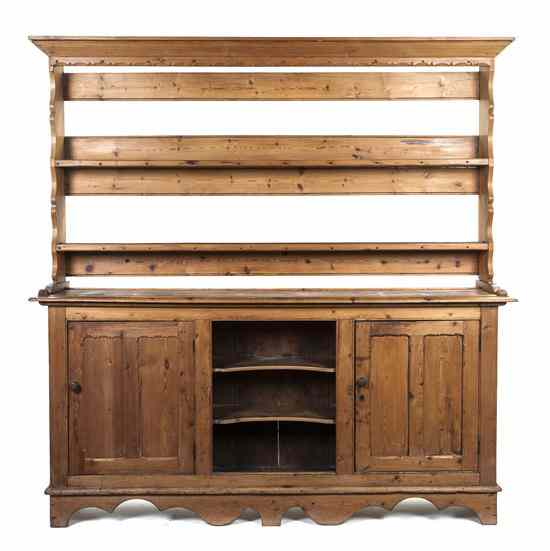 Appraisal: A Pine Welsh Cupboard having a tapering cornice over two