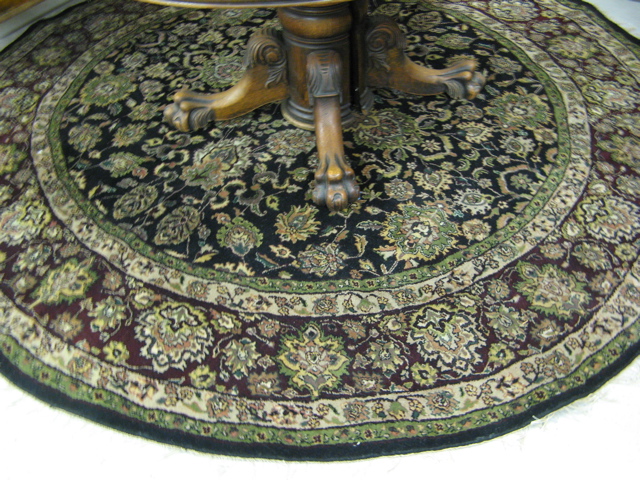 Appraisal: ROUND ORIENTAL CARPET Indo-Persian overall floral design across the black