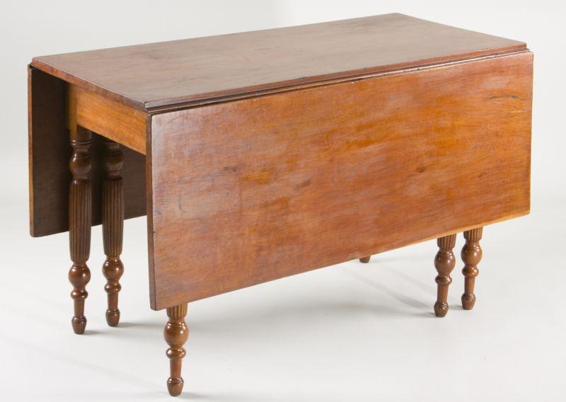 Appraisal: Kentucky Cherry Dining Table th c drop-leaf form with swing