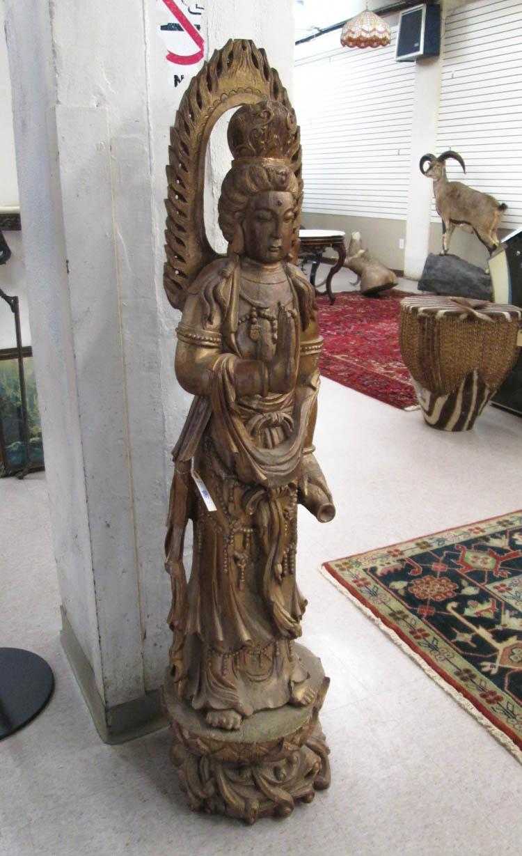 Appraisal: LARGE CARVED GILTWOOD FIGURE OF GUANYIN Tibet th century hand