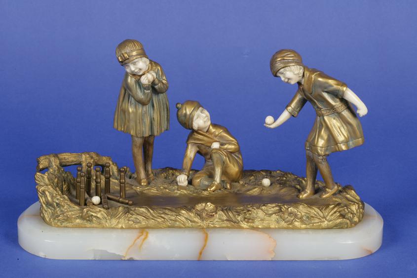 Appraisal: DIMITRI CHIPARUS A BRONZE AND IVORY SCULPTURE of three children