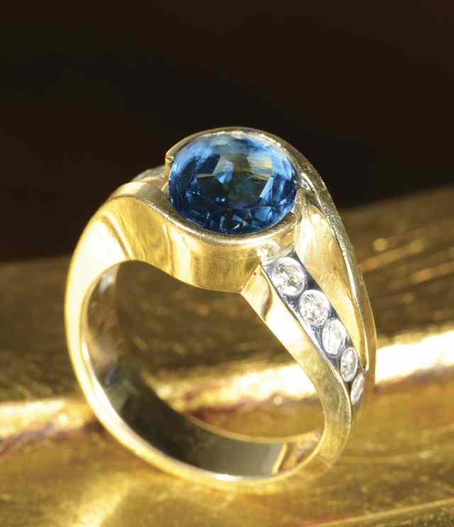 Appraisal: BLUE TOPAZ AND DIAMOND RING k yellow and white gold