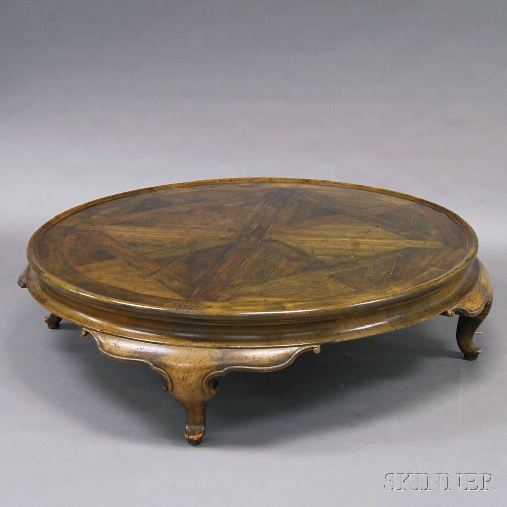 Appraisal: Large Asian-style Hardwood Circular Coffee Table the dish-top on compressed