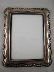 Appraisal: A silver faced photo frame x cm back missing strut