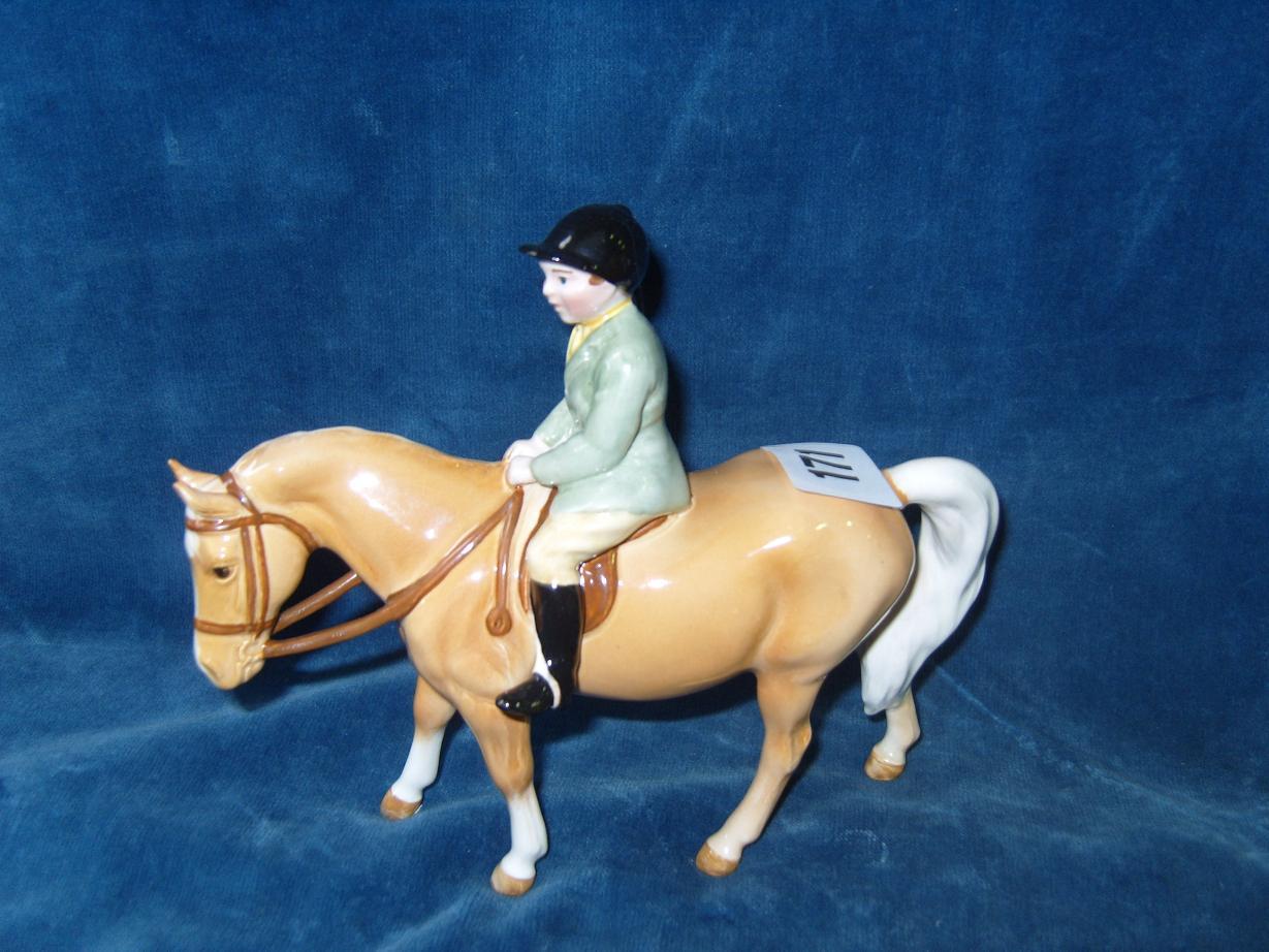 Appraisal: A Beswick model of a child in green hunting jacket