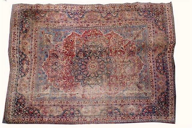 Appraisal: AN ANTIQUE PERSIAN BLUE GROUND CARPET decorated a central medallion