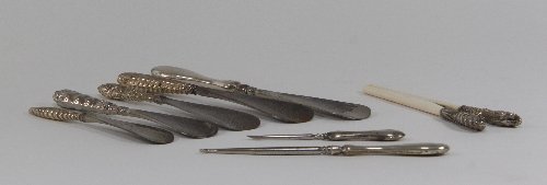 Appraisal: Five silver-handled shoe horns a pair of silver-handled glove stretchers