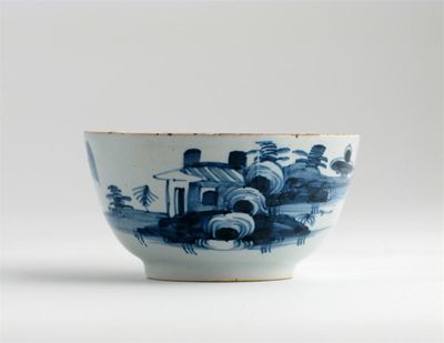 Appraisal: A Delftware blue and white shallow teabowl painted with a