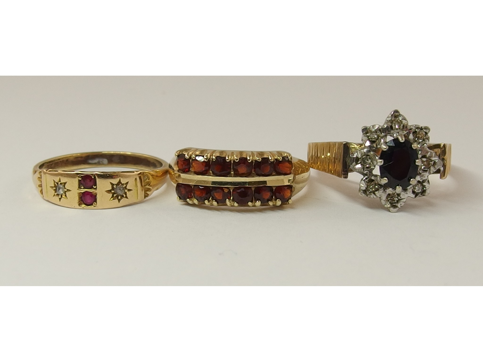 Appraisal: A ct double row garnet ring a ct retro sapphire