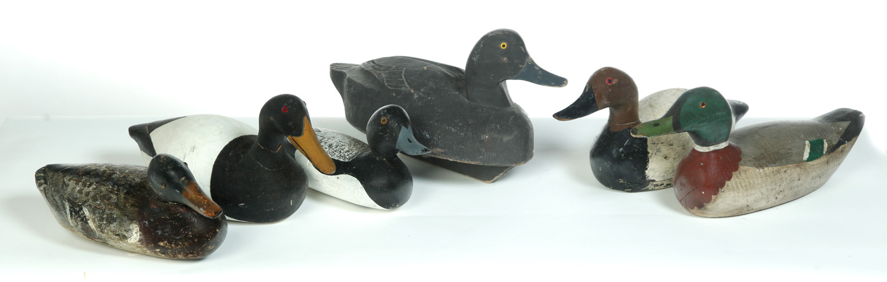 Appraisal: SIX DUCK DECOYS WITH OLD PAINT American th century Brown