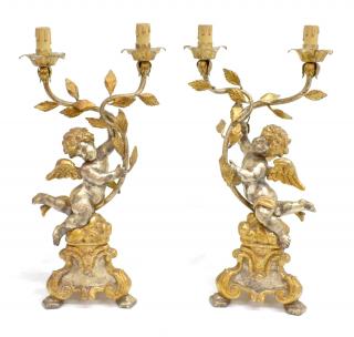 Appraisal: ITALIAN PUTTI CUPID -LIGHT GILTWOOD LAMPS pair Italian silvered and