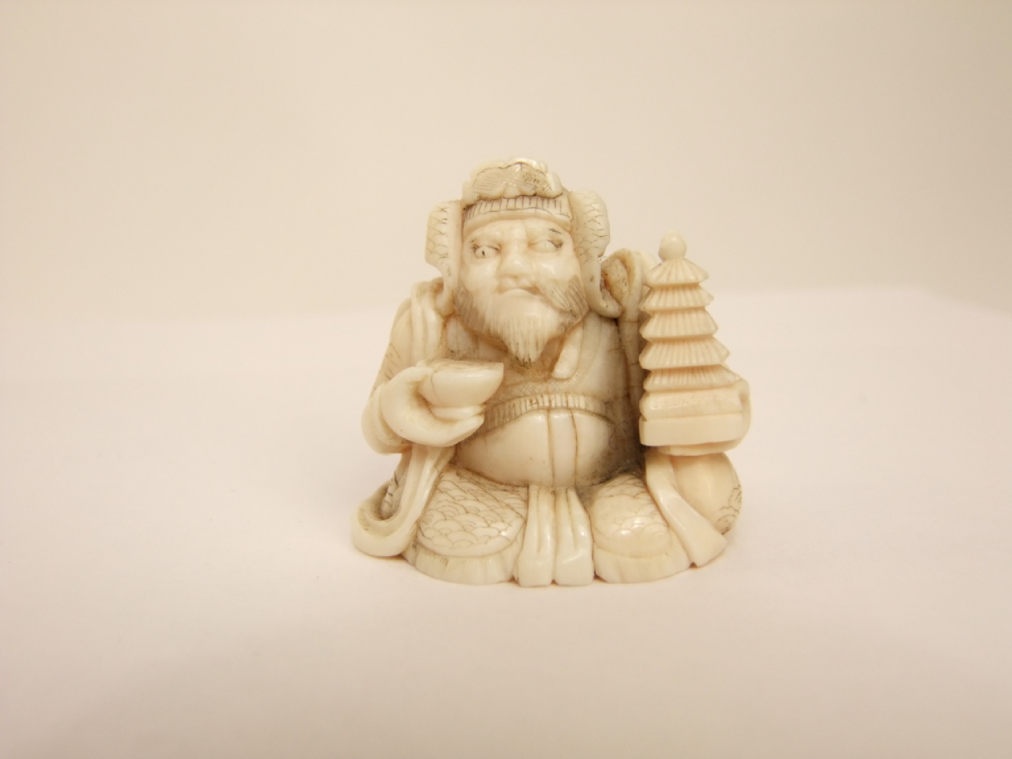 Appraisal: A late th early th century Japanese ivory figure seated