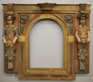 Appraisal: Polychrome figural mirror A th century European polychrome wood and