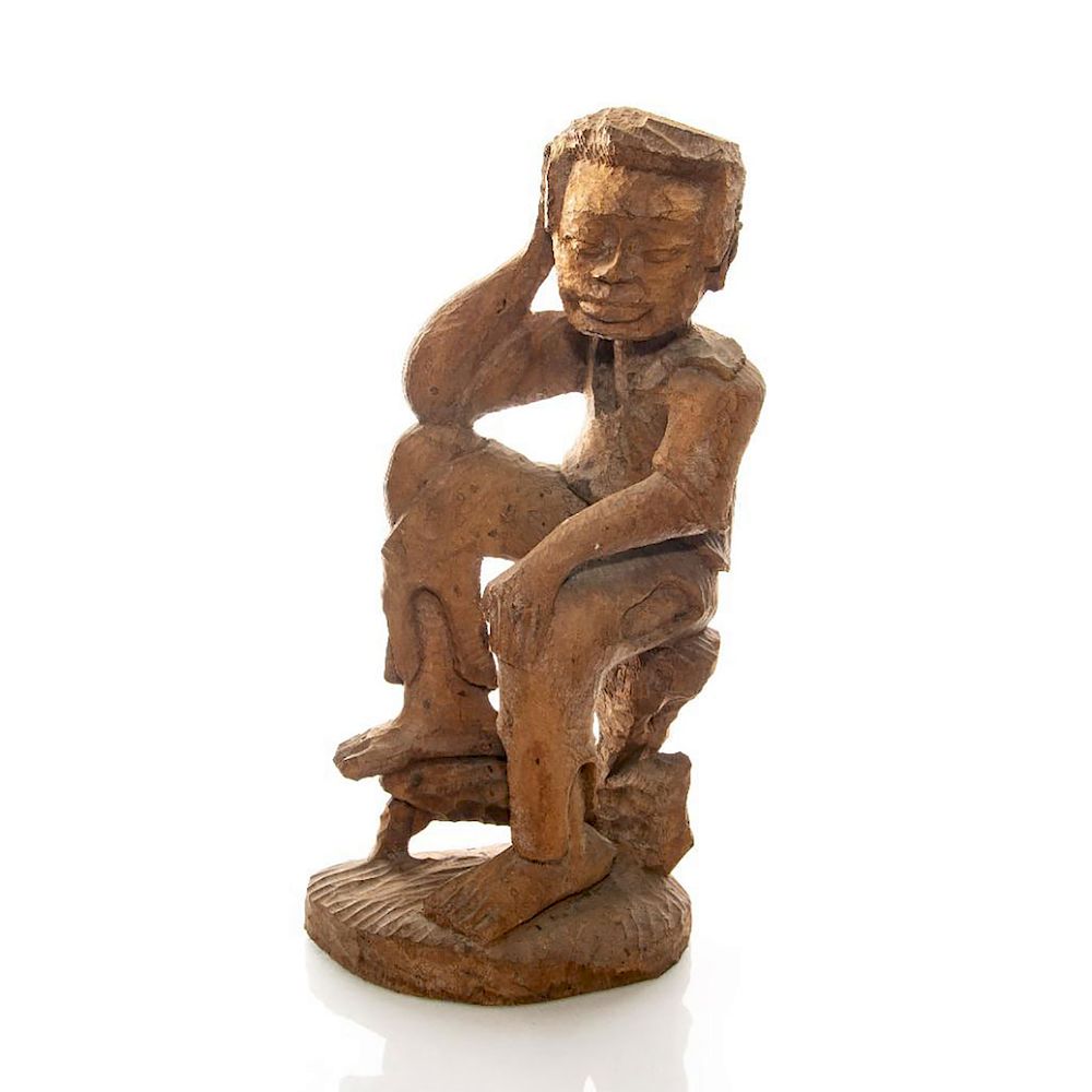 Appraisal: HAND CARVED WOODEN SCULPTURE OF YOUNG MAN SITTING Man with