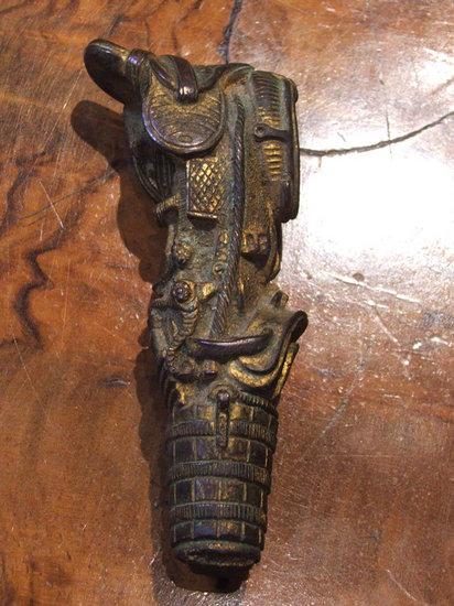 Appraisal: A GILT BRONZE SEAL OR STICK HANDLE in the form