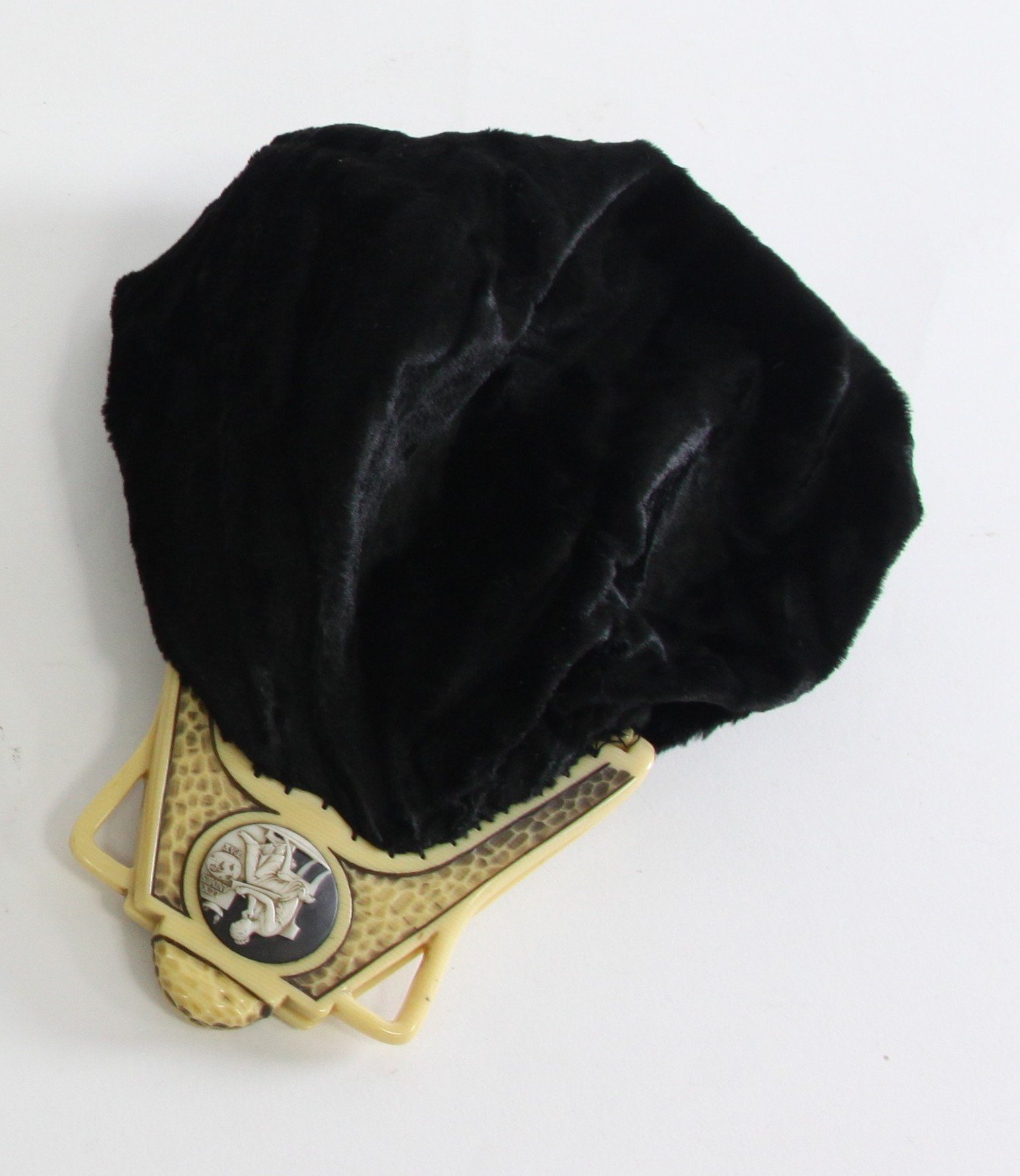 Appraisal: A black velvet evening bag with ivorine mounts each set