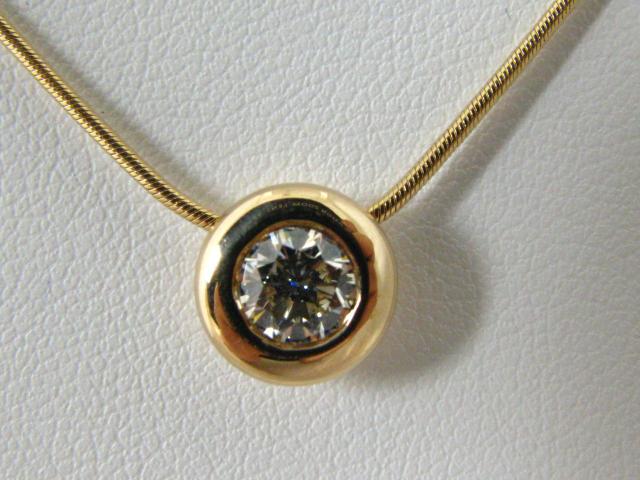 Appraisal: K yellow gold bezel set diamond pendant with ct VS